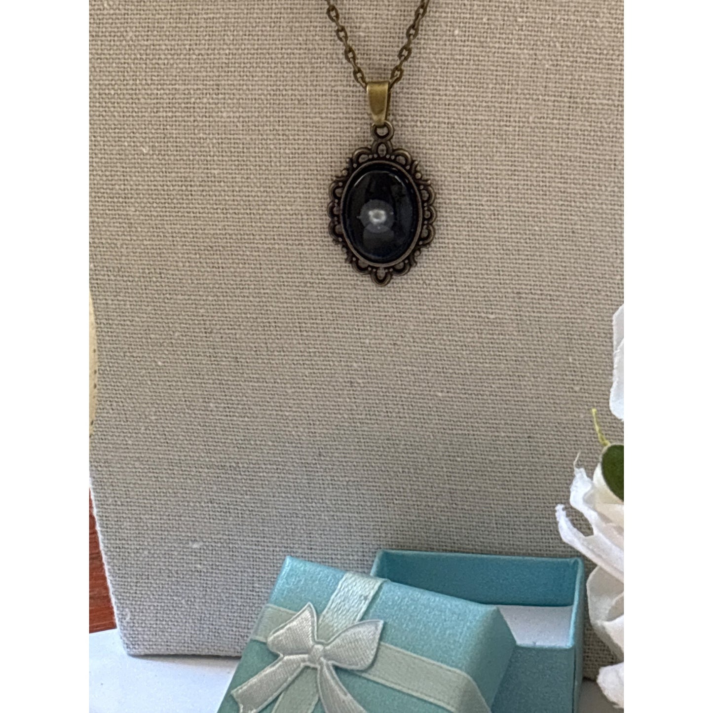 Floating Pearl Pendant Oval Black Background: Handmade in San Diego