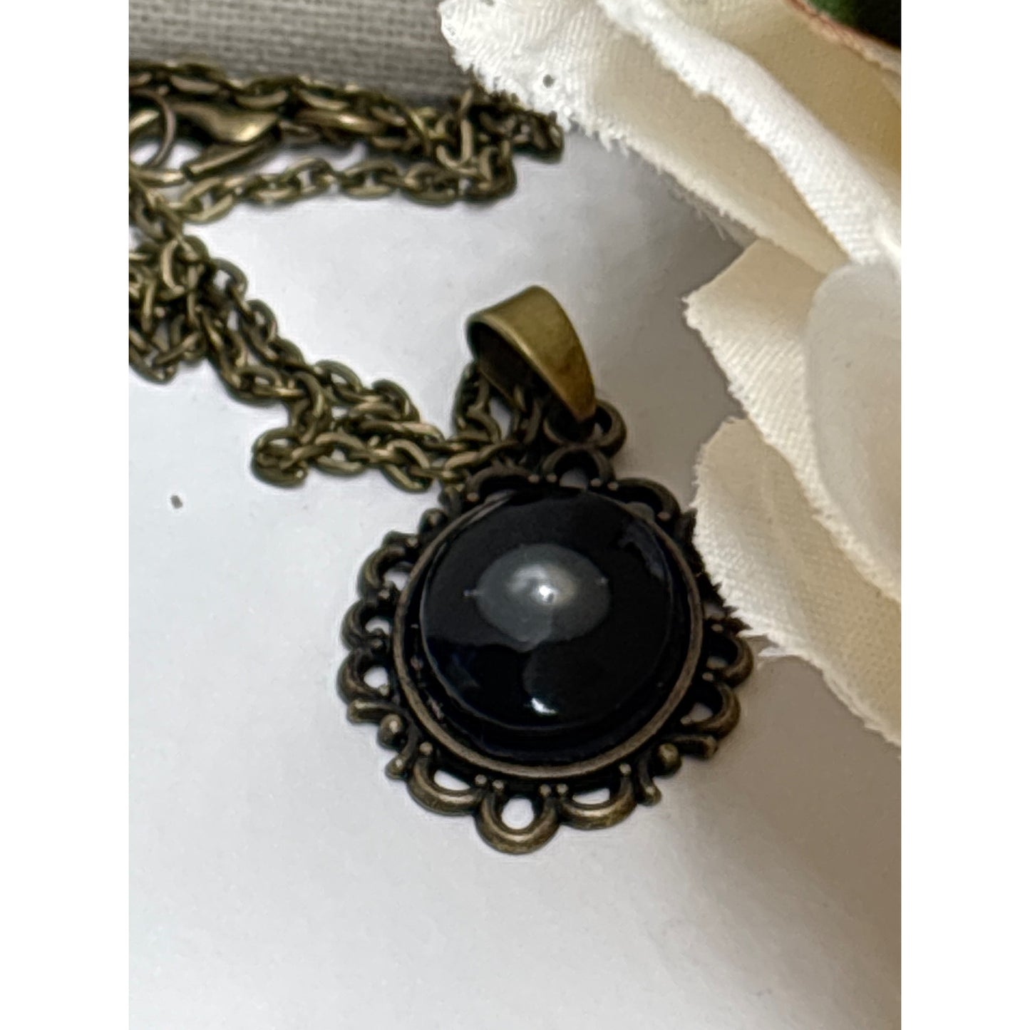 Floating Pearl Pendant Oval Black Background: Handmade in San Diego