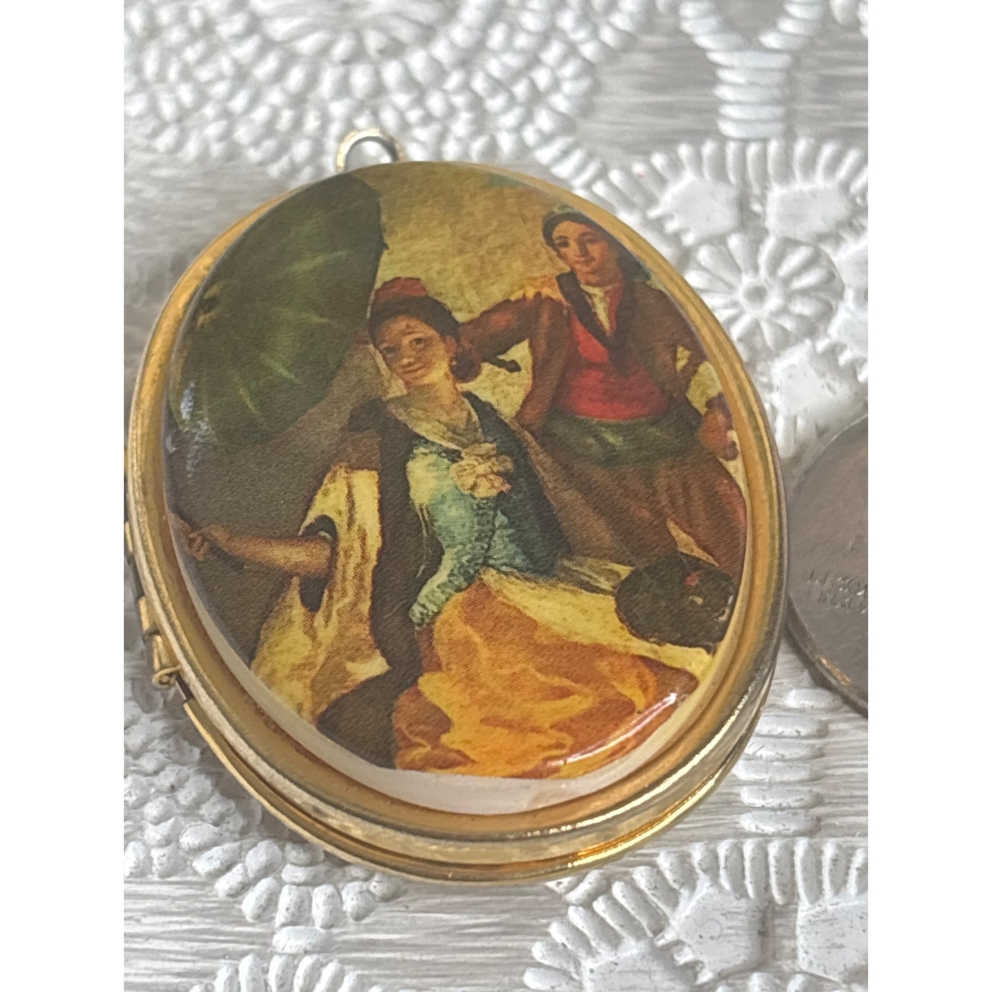 Vintage Gold Tone Oval Locket With Painted Scene Of Couple & Umbrella Hinged Design Holds Two Photos